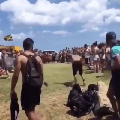 A guy doing flips almost hit by a rock luckily someone save him from that tragedy.