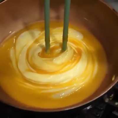 Neatly placing a spiraled omelette.