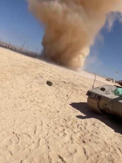 Men run toward massive dust devil