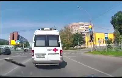 Ambulance stops on the road for no reason.