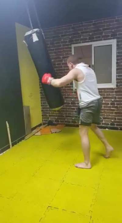My Kickboxing coach beating a Punch bag...