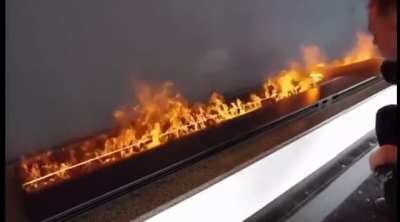 These flames are touchable. They are not even flames, actually as they are made by water vapor lit by LED lights