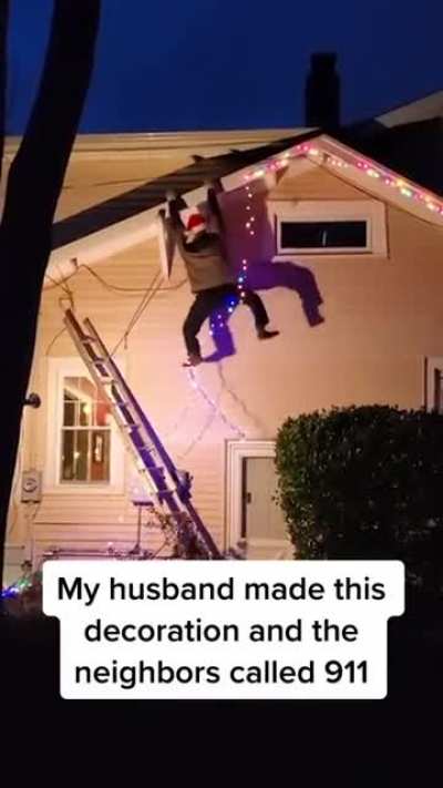 WCGW hanging a hanging Christmas light hanging man.