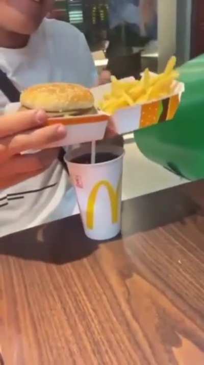 To show how youâre supposed to handle and eat the McDonaldâs combo