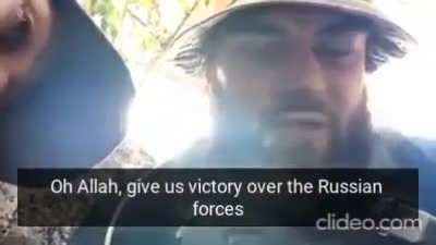A jewish and a muslim soldier in a trench are taking cover from Russian shelling