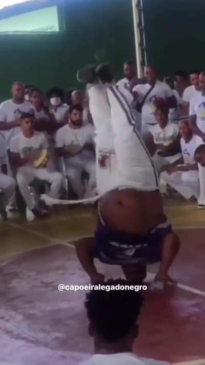 Overweight capoeira dancer shows great agility and flexibility