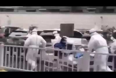 Coronavirus victim being wheeled across the street
