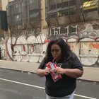 Woman's personal trainer doesn't like the Twizzlers in her hand