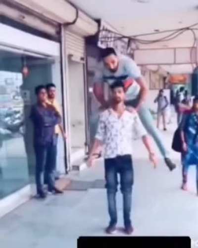 By trying to jump over your friend in tight jeans