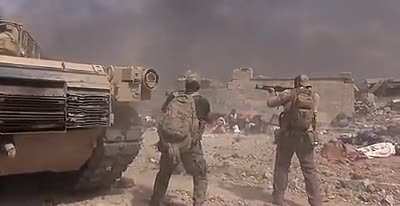 Soldiers retrieving a young girl from "the kill zone" during combat