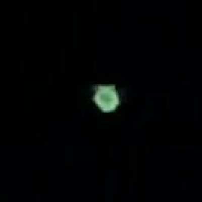 Rainbow ball of light moving in the sky