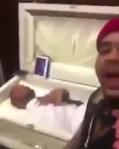 guy slaps corpse