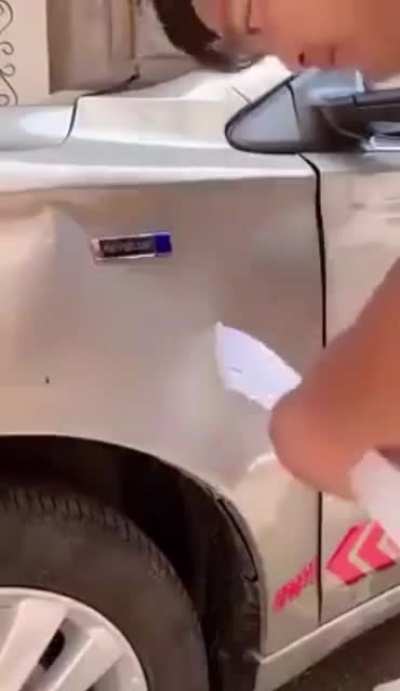 WCGW trying to fix a dent with hot glue