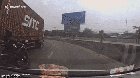 Biker reacts to trailer being to topple on curve