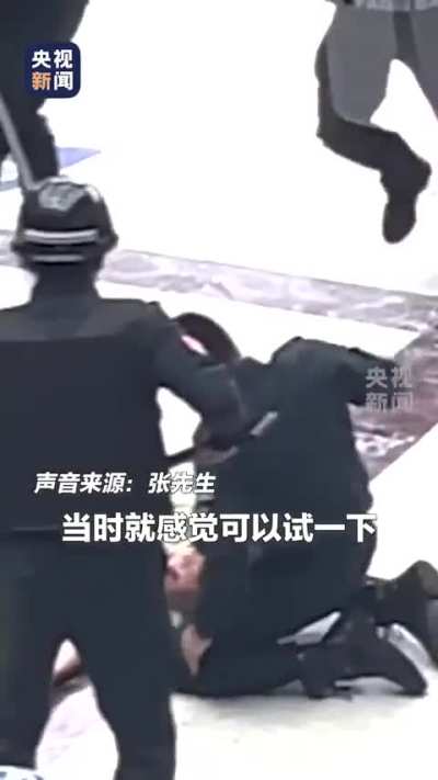 Chinese policeman stops a wanted person