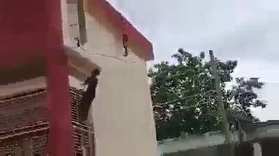 Indian guy becomes Spider Man to save the kid hanging from the roof ?