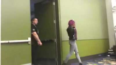pro wrestler Sasha Banks arrives at a fan signing and a fan freaks out