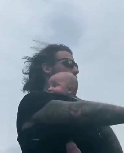 Daddy bringing baby to have a ride of his life