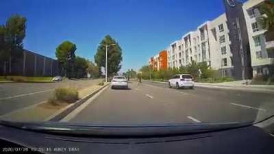 Jaywalker almost causes multi car crash