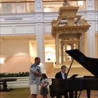 Daddy sings Ave Maria in hotel lobby. His daughter’s look is everything.