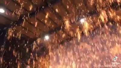 Smacking molten iron with a shovel