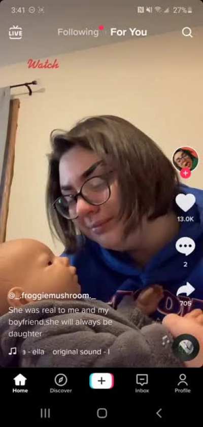 Crying over a baby doll