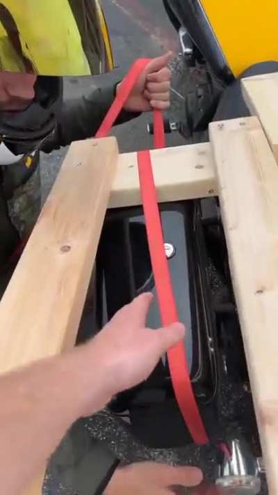 Man picks a 65" Tv on a motorcycle