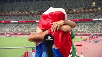 Just two Italian gold medalists hugging and kissing?
