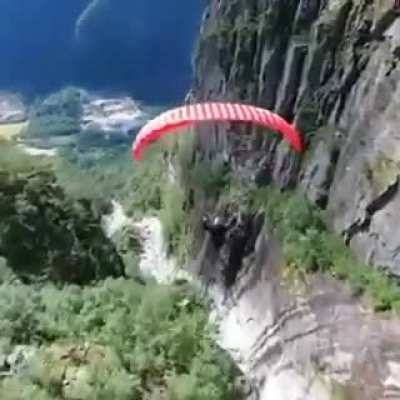 Gliding through the mountains &amp; valley below