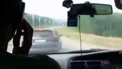 Guy driving like an idiot,tailgates a man who is driving with his wife and child. The idiot then passes and brake checks the family and corners them in with no escape leaving the dad no option but to protect his family. Idiot driver gets a lesson in "dad