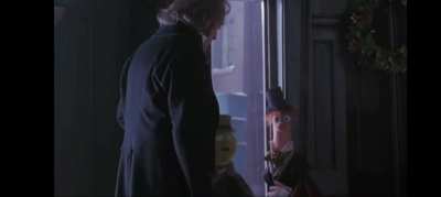 I was watching the muppets Christmas Carol and I just noticed that beaker gives scrooge the finger!