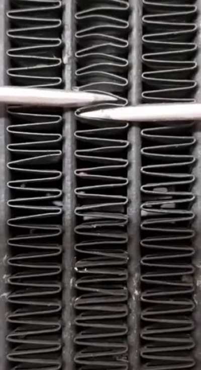 Fixing a motorcycle radiator.