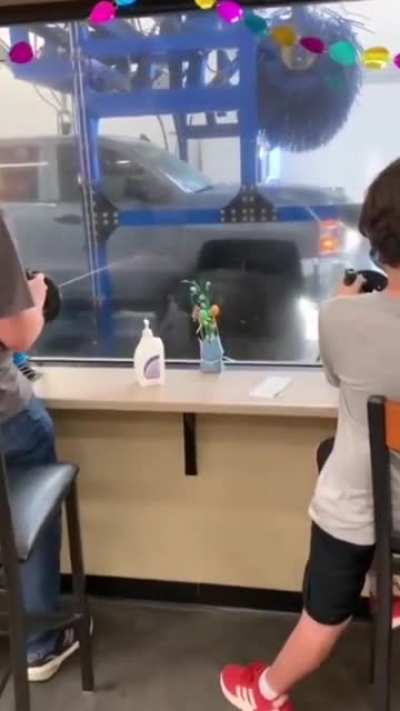 This carwash lets the kids use spray guns while the vehicle goes through