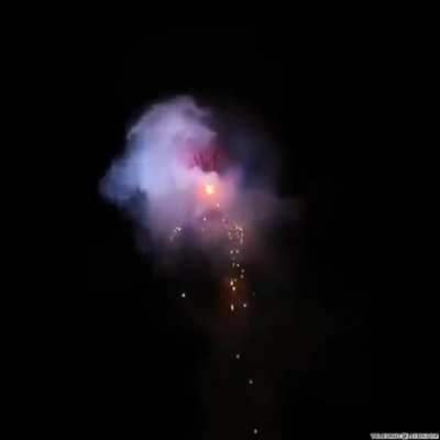 Setting off fireworks from a hot air balloon.