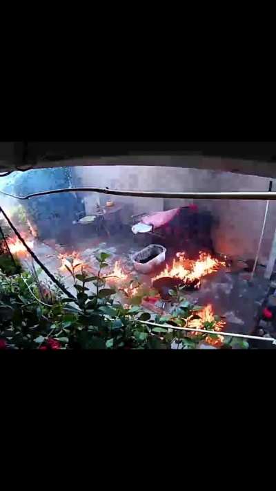 A guy attempts to put out BBQ fire