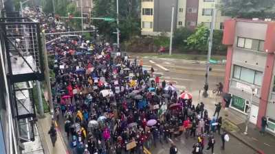 Seattle had a silent march today in the rain. "We move, together, in silence”