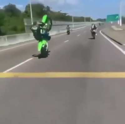 This dude being a wheelie big idiot on the highway