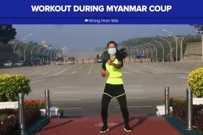 PE Teacher dances while initial moments of coup is happening in the background