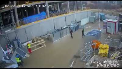 Crane drops its load at a construction site