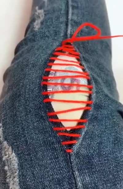 When she pulls the thread tight on this perfect denim seam repair ?