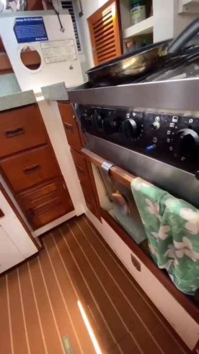 Self leveling stove on a boat