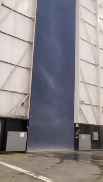 ?Rainstorm beyond the hangar door