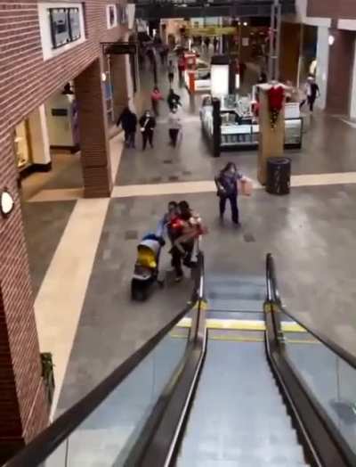 Shoppers run for the exit after 3 people were shot at Southpoint Mall in Durham, North Carolina