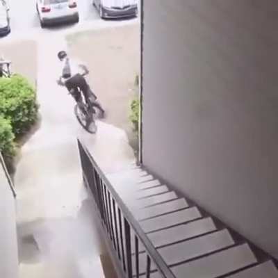 to ride a bike down a set of stairs.