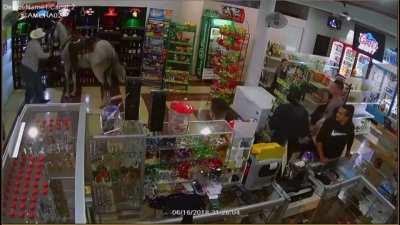 Drunk man rides horses into liquor store?