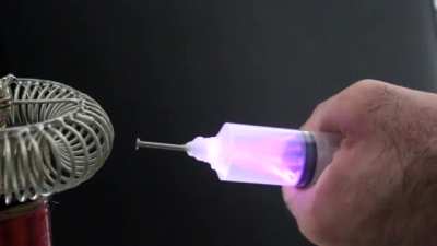 Extracting electricity from a tesla coil