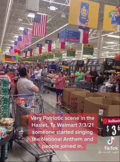 Americans singing the national anthem in Texas Walmart