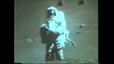 A rare glimpse of the face of an astronaut during a moon EVA (wait for zoom in). Apollo 17's LMP Harrison "Jack" Schmitt has his gold visor up, making his face visible to the tv camera.