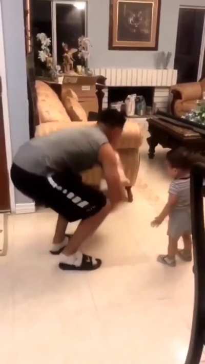 This man was tossing his kid in the air and the doggo said where's my turn to get tossed