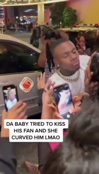 Dababy tries kissing a fan and gets curved ?